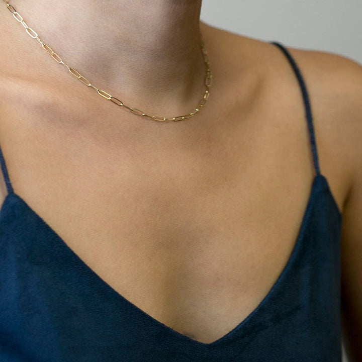 Elegant long link chain necklace for women, versatile gold finish jewelry, perfect statement piece.