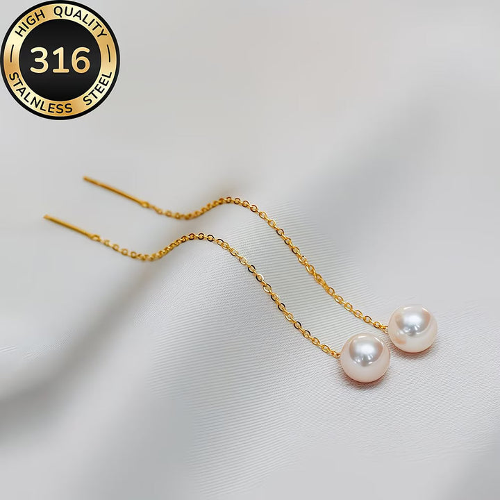 Elegant long tassel pearl drop earrings for women. Stylish fashion accessory, perfect for evening wear.