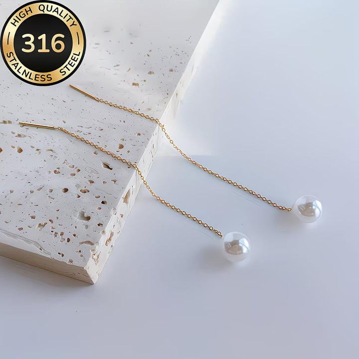 Sophisticated women's pearl tassel drop earrings. Elegant long design, ideal as a chic fashion accessory.