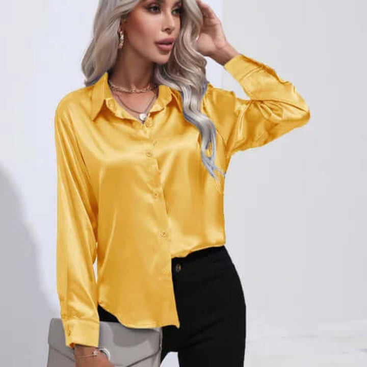 Elegant women's blouse with long sleeves & a loose fit. A chic, versatile top for workwear fashion.