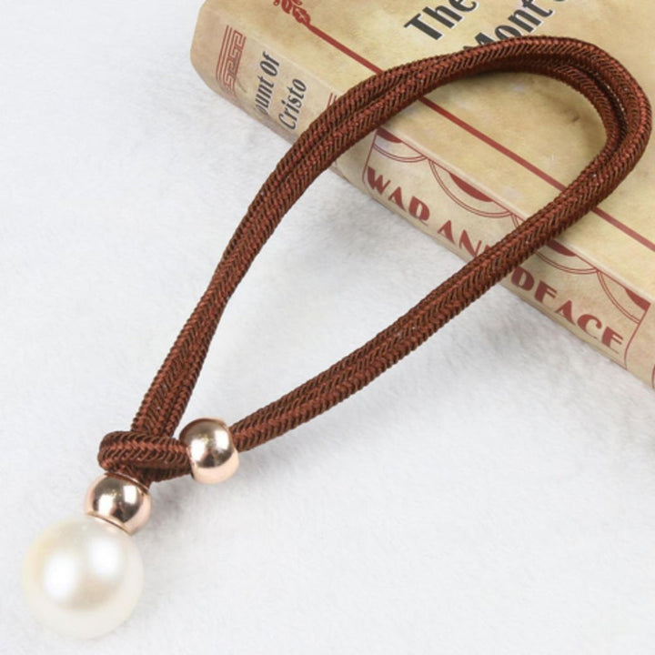 Decorative home accent: A pair of elegant magnetic pearl curtain tie backs for windows.