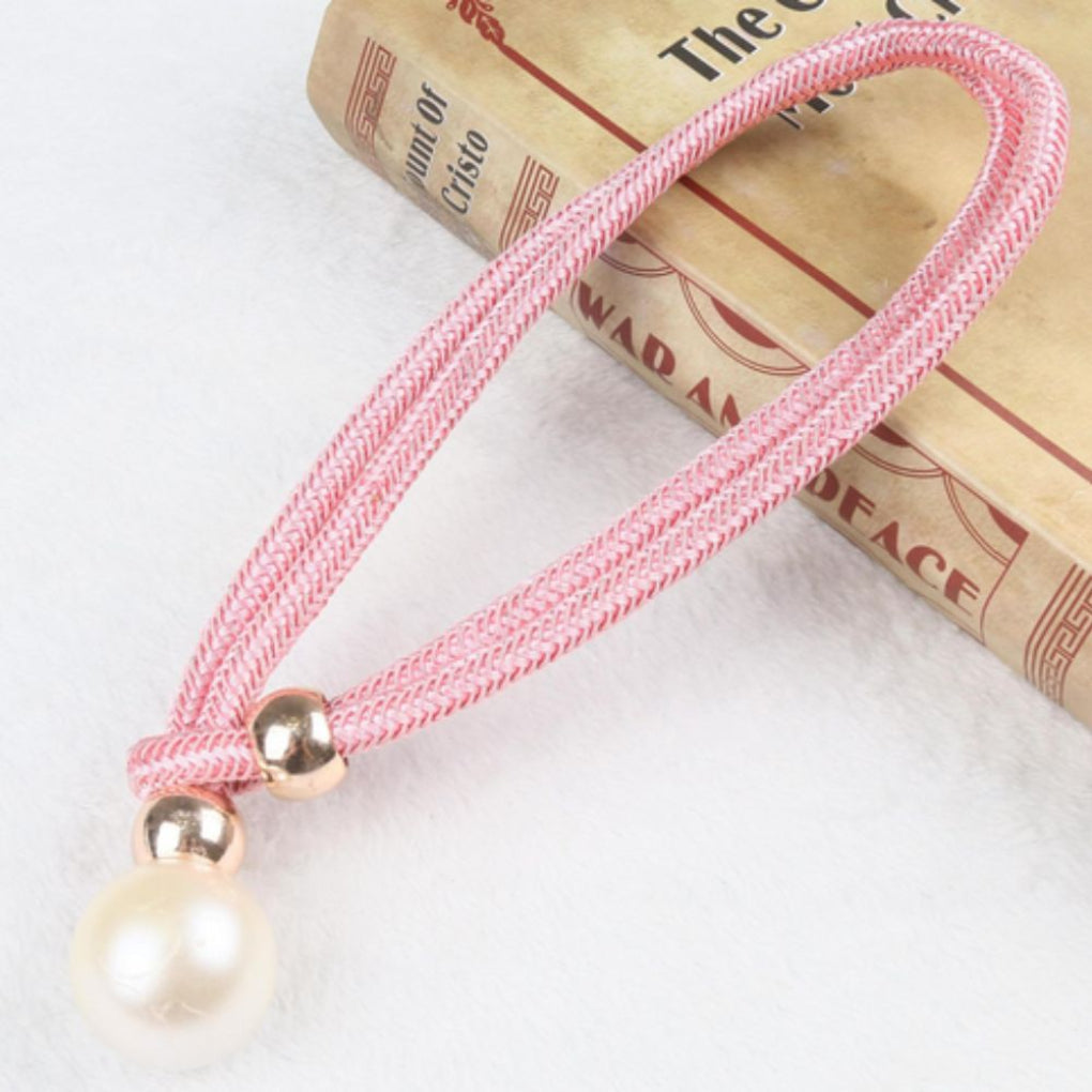 Sophisticated magnetic pearl curtain tie backs, elevating bedroom and living room decor.