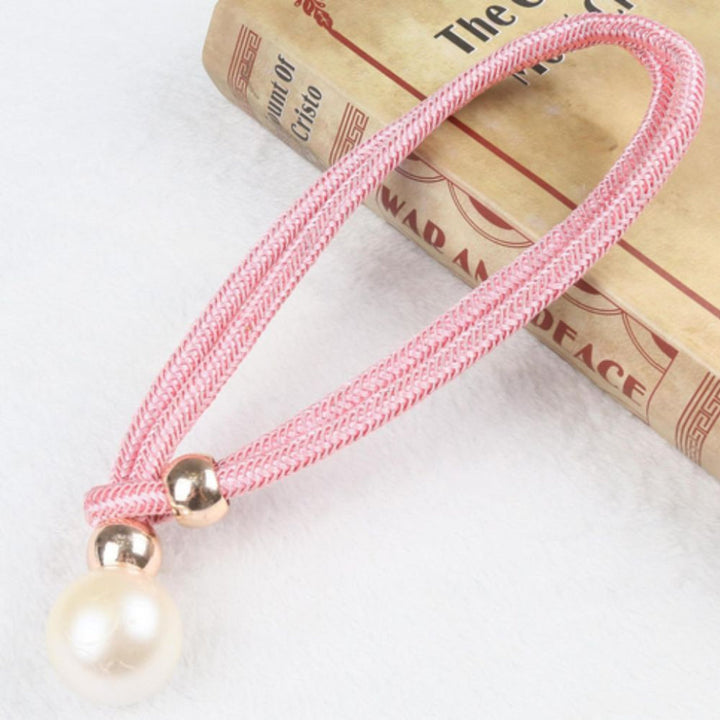 Sophisticated magnetic pearl curtain tie backs, elevating bedroom and living room decor.