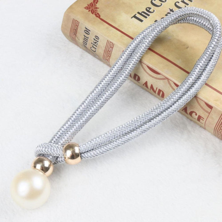 Stylish magnetic pearl curtain holders, perfect for bedroom or living room window treatments.