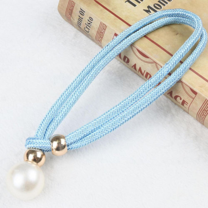 White pearl magnetic curtain tiebacks, set of two, enhancing window decor with ease.