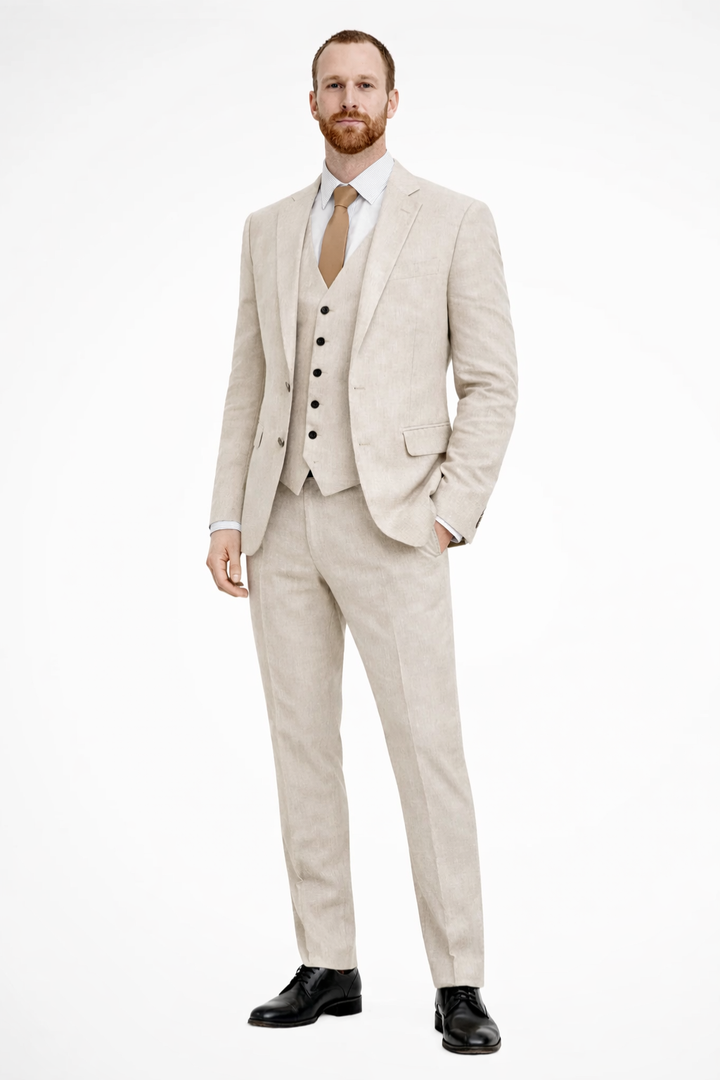 Tailored men's suit for formal events. Elegant 3-piece wedding guest outfit with blazer, vest, trousers.
