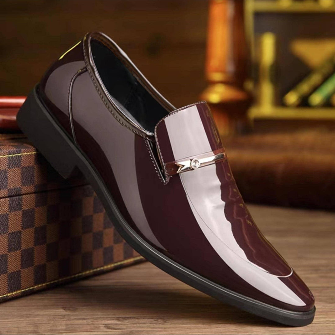 Classic black pointed toe slip-on loafers, ideal men's dress shoes for professional events.