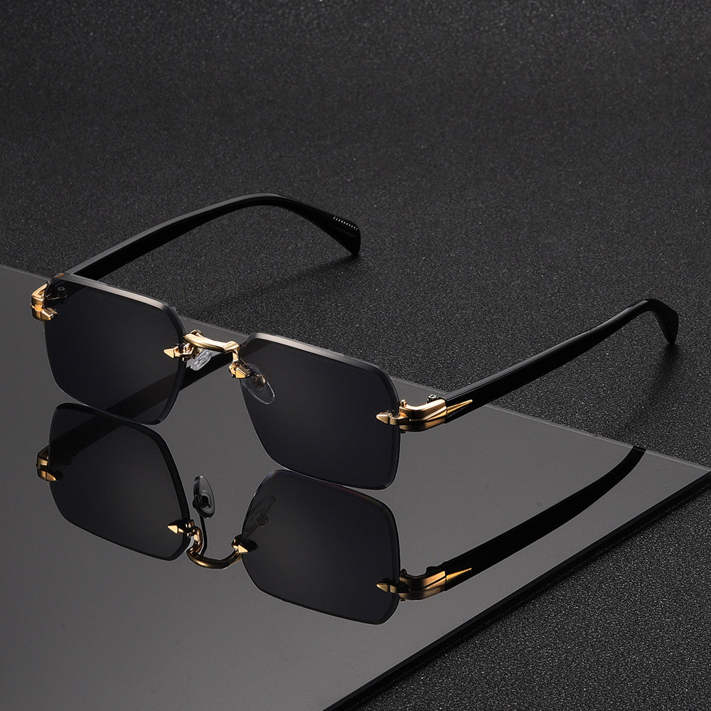 Man wearing elegant rimless square gold-frame glasses, showcasing sophisticated and comfortable eyewear.