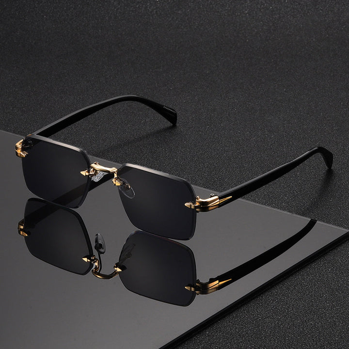 Man wearing elegant rimless square gold-frame glasses, showcasing sophisticated and comfortable eyewear.