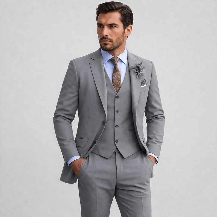 Classic men's elegant three-piece formalwear suit, comprising a blazer, waistcoat, and trousers, suitable for weddings.