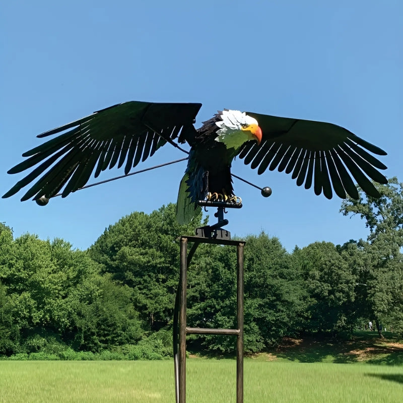 Elegant metal bird wind spinner sculpture for garden decor. Durable outdoor art, perfect for patio or lawn.