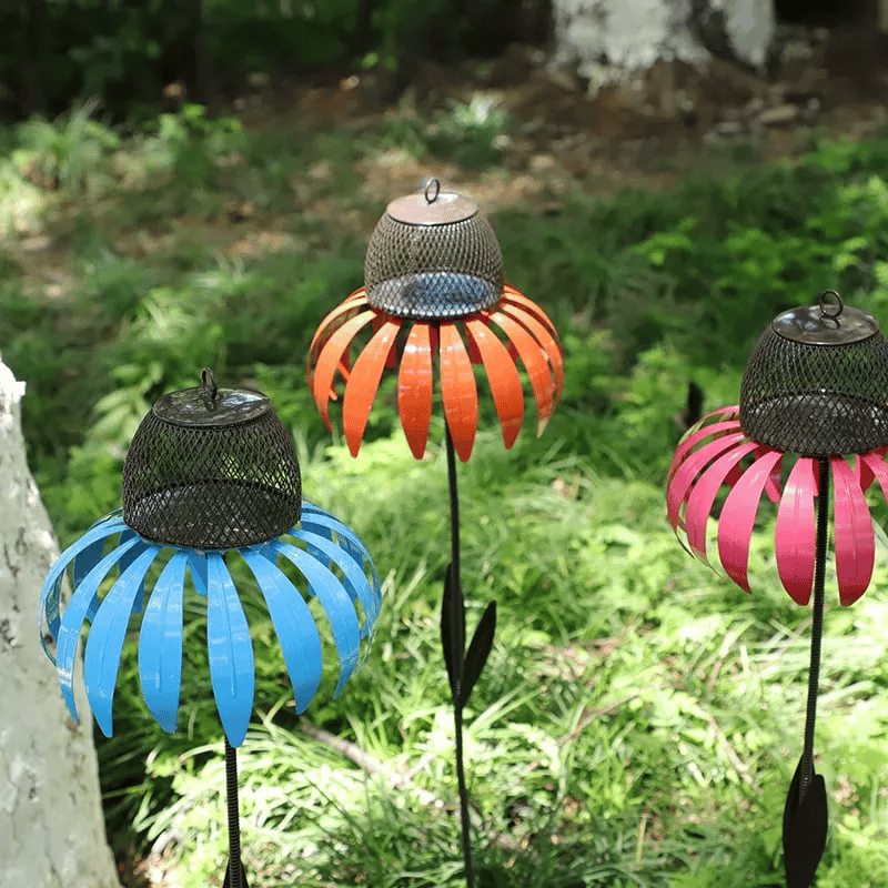 Colorful metal flower bird feeder house. Elegant garden art, functional and a perfect patio accent.