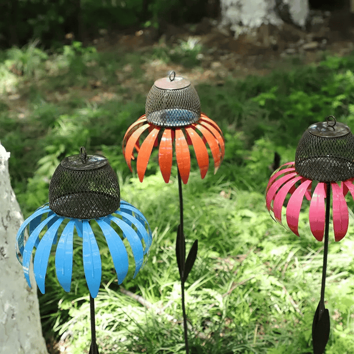 Colorful metal flower bird feeder house. Elegant garden art, functional and a perfect patio accent.