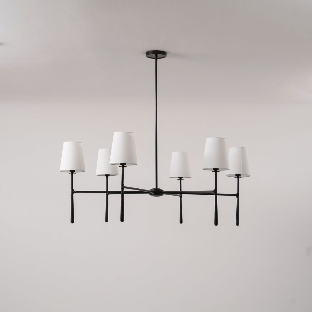 Elegant brass chandelier, mid-century style, hardwired lighting.