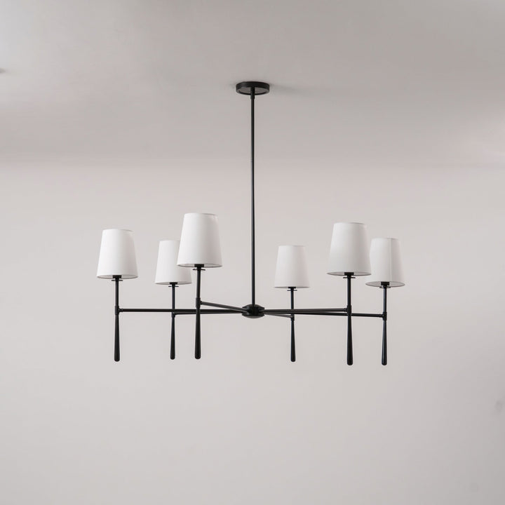 Elegant brass chandelier, mid-century style, hardwired lighting.