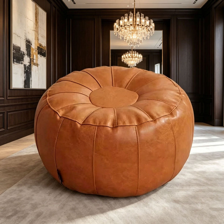 Stylish round accent stool, modern design for bedroom furniture. Elegant contemporary footrest or home decor piece.