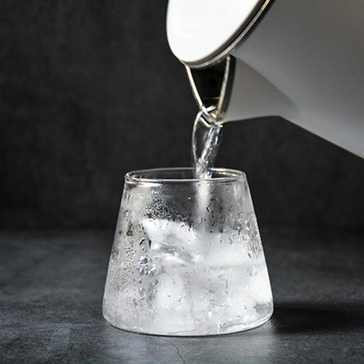 Crystal clear Mt. Fuji Japanese glass for spirits. Elegant whiskey, beer, bourbon drinkware. Unique bar accessory.