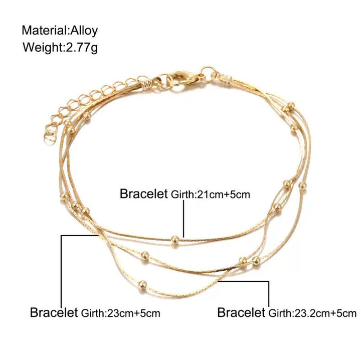 Chic multi-strand beaded bracelet for women, featuring a beautiful layered design in gold and silver tones.