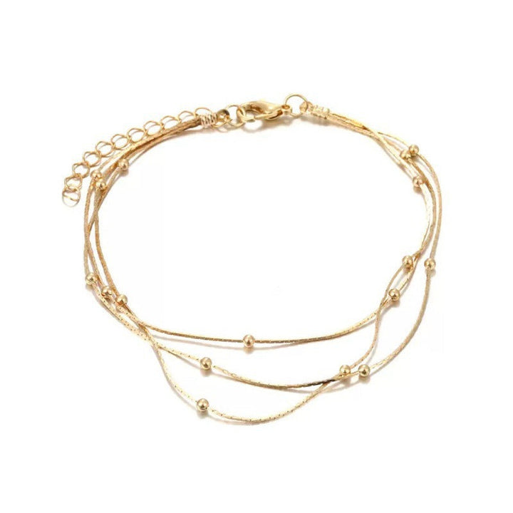 Adjustable women's multi-strand beaded bracelet, available in stunning silver or gold for an elegant look.