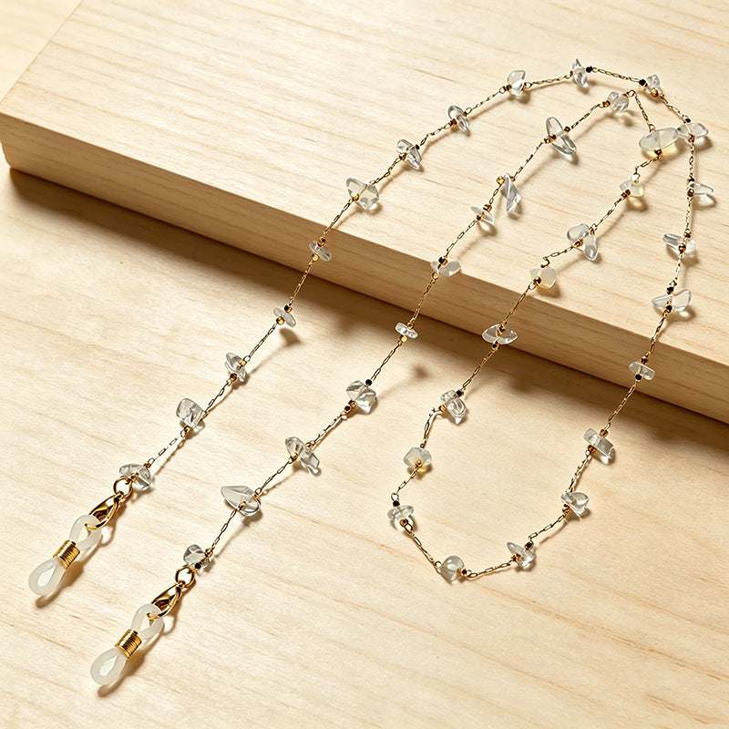 Women's elegant layered necklace with an array of colorful gemstones.