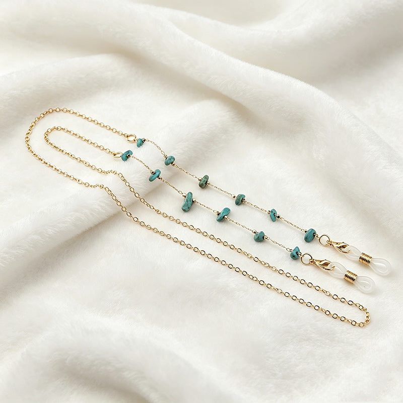 Elegant layered gemstone necklace with diverse colorful stones.