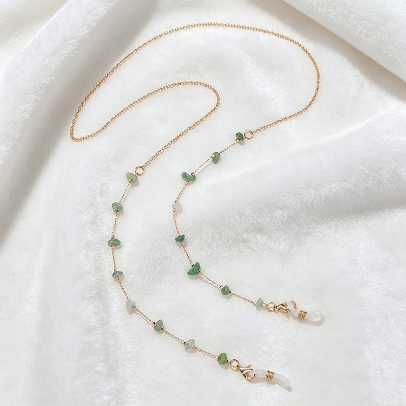 Fashionable multi-string necklace featuring vibrant colorful gemstones.