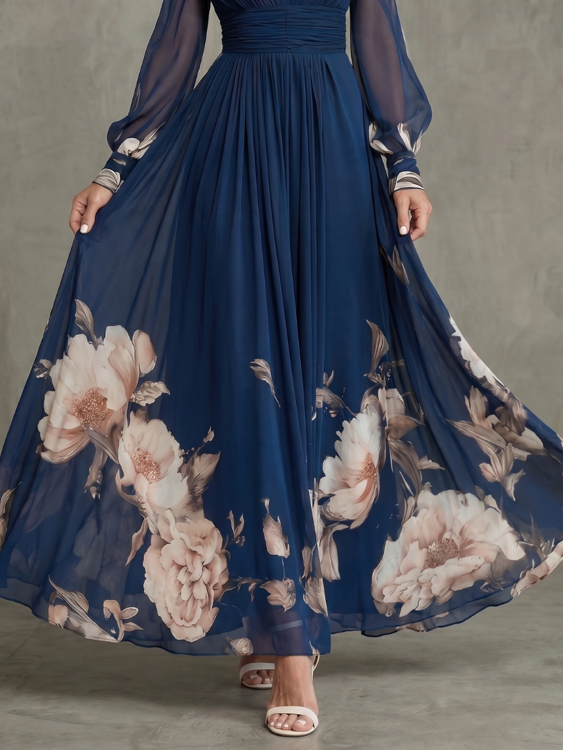 Flowy printed maxi dress for women in navy blue, with delicate sheer sleeves & a flattering plunge neckline. Evening wear.