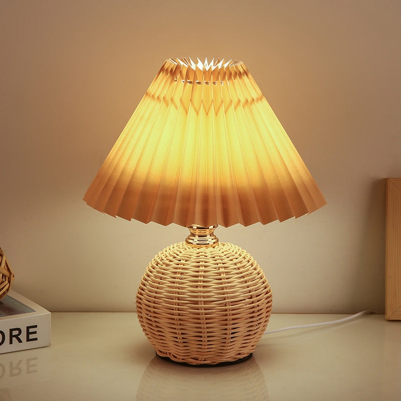 Rattan LED bedside lamp, sleek Nordic design adds warmth to bedroom and living room.