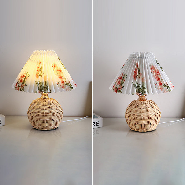 Ambient LED table lamp, elegant rattan and fabric shade creates relaxing bedroom mood.
