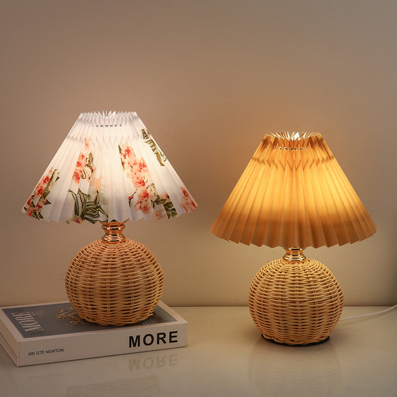 Nordic home decor LED lamp, elegant rattan table light with a soft fabric shade.