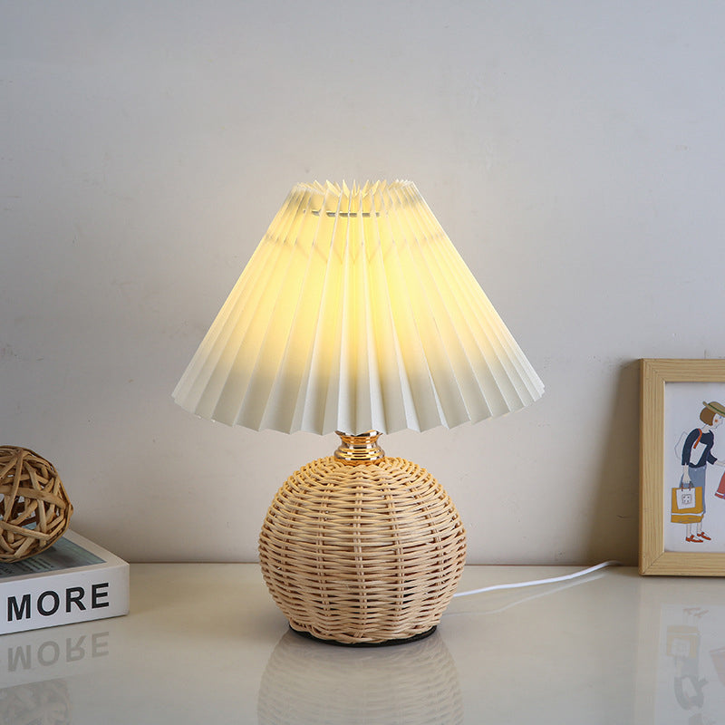 Contemporary LED rattan table lamp, ideal for bedroom & living room lighting, USB power.