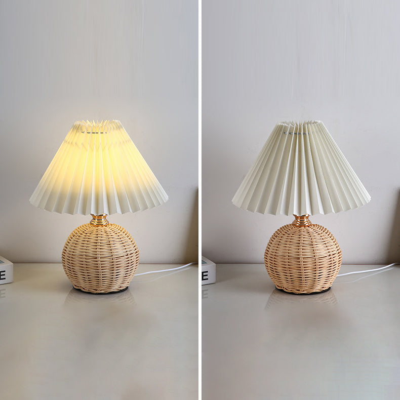 Living room LED table lamp, modern rattan and fabric shade for warm mood lighting.