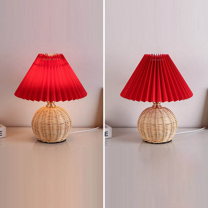 Elegant LED table lamp featuring a rattan base and fabric shade, perfect for bedrooms.