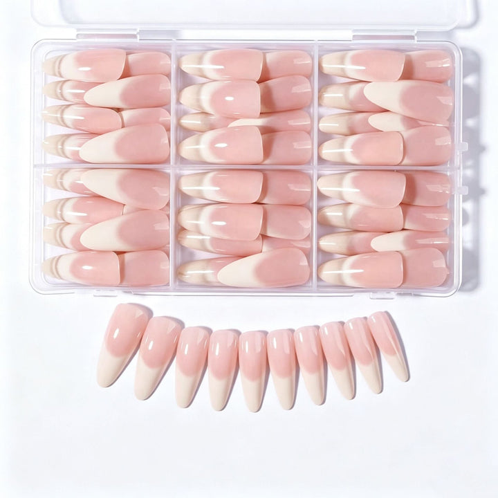 Nude pink elegant press-on nail tips for women. Stylish artificial nails for a quick and easy manicure.