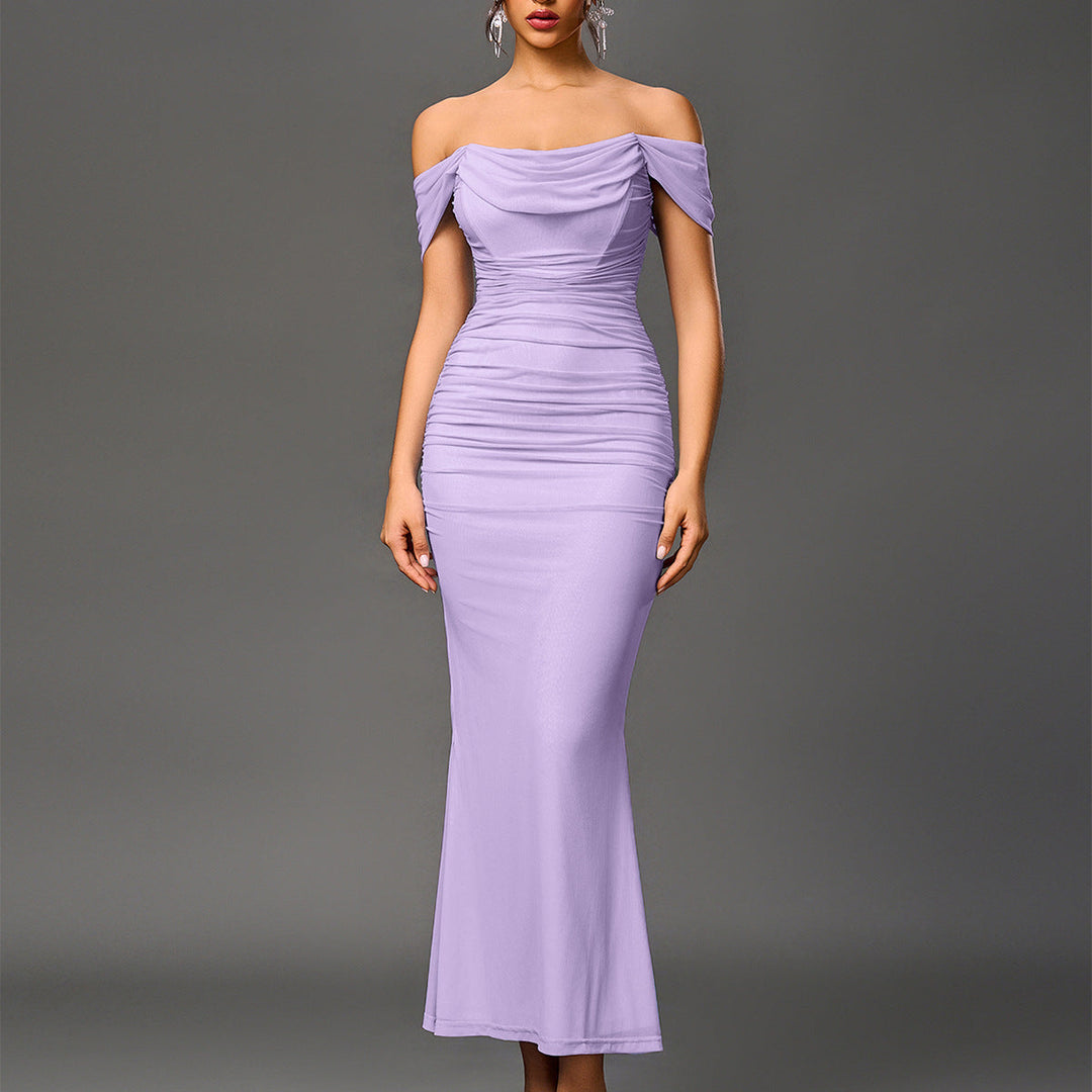 Women's elegant mermaid gown with off-shoulder neckline and striking backless detail.