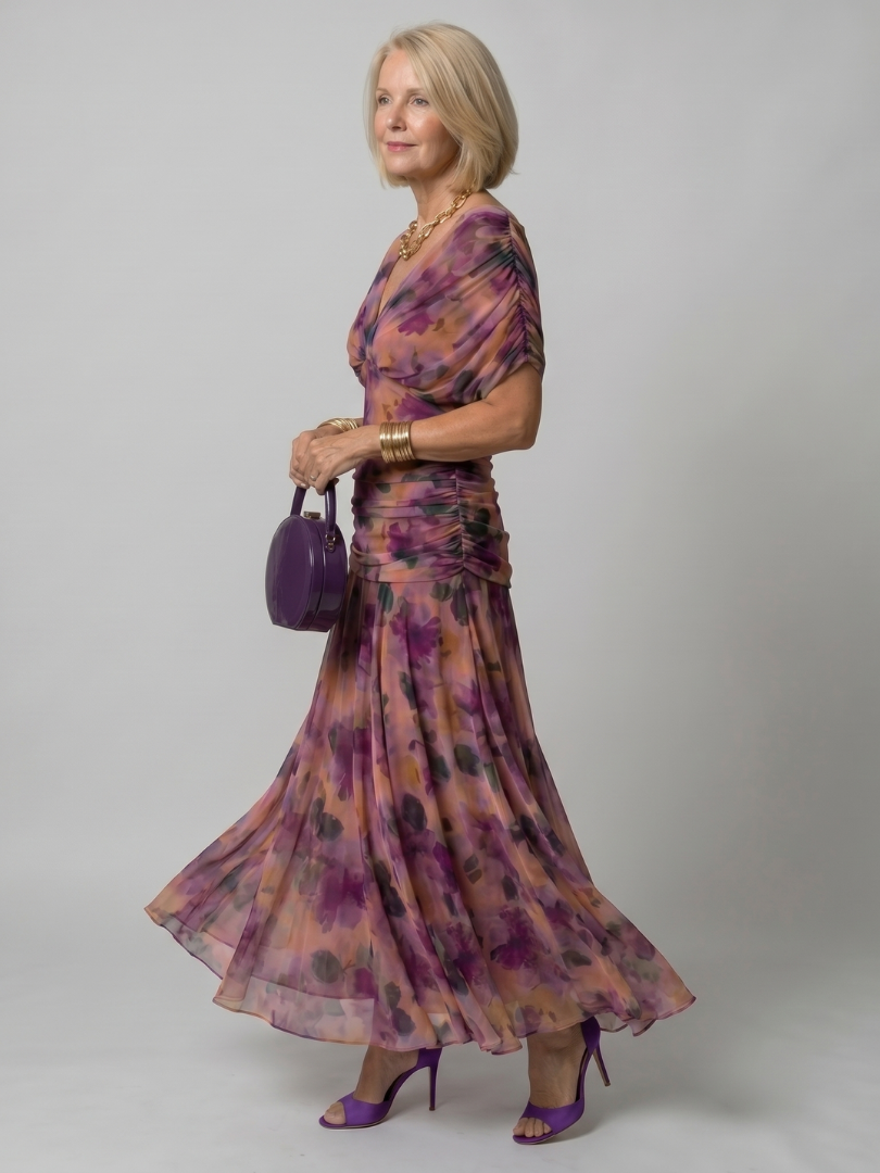 Women's red off-shoulder midi dress with a flowing silhouette, ideal for evening events.