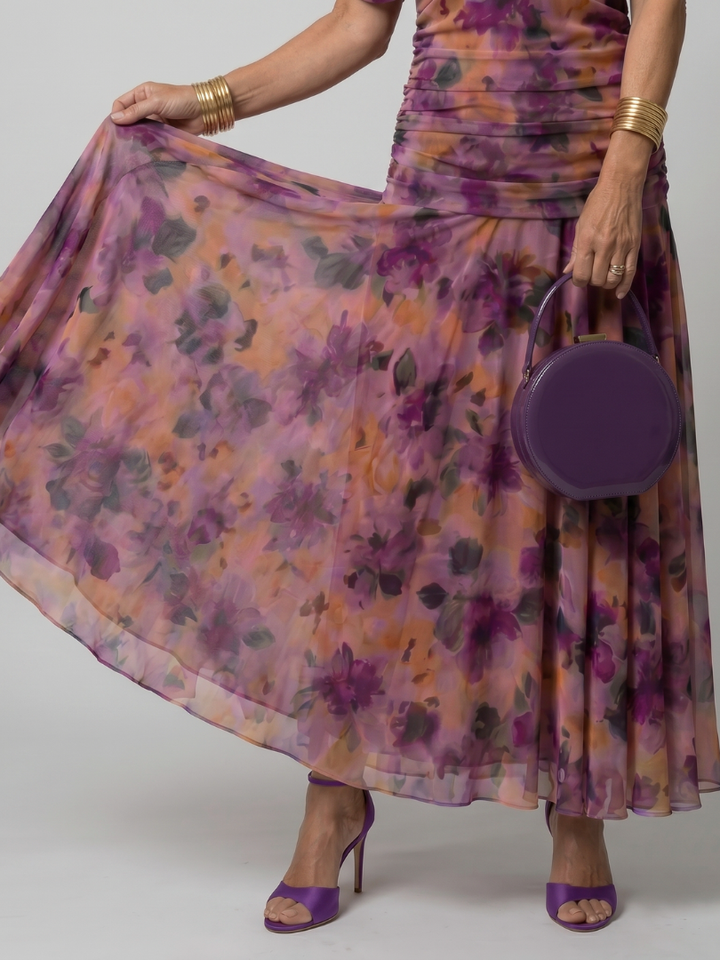 Green off-shoulder flowy midi dress, a comfortable choice for casual summer fashion.