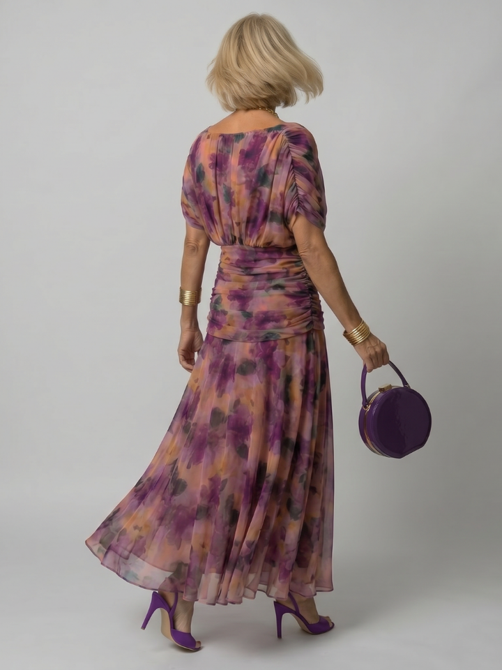 Stylish purple off-shoulder midi dress, featuring an elegant draped neckline.