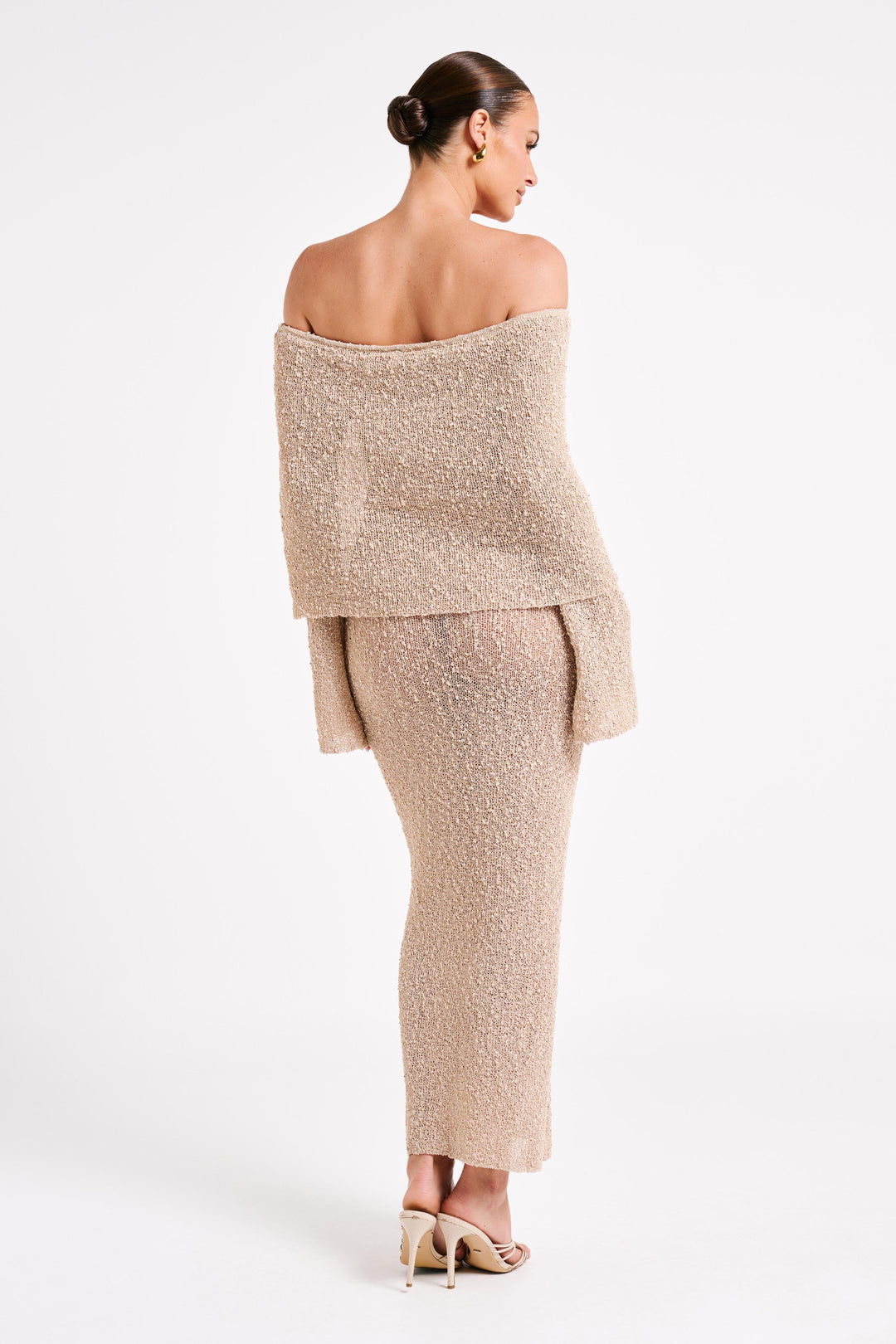 Glamorous off-shoulder maxi dress, sophisticated long sleeve option for women's evenings.