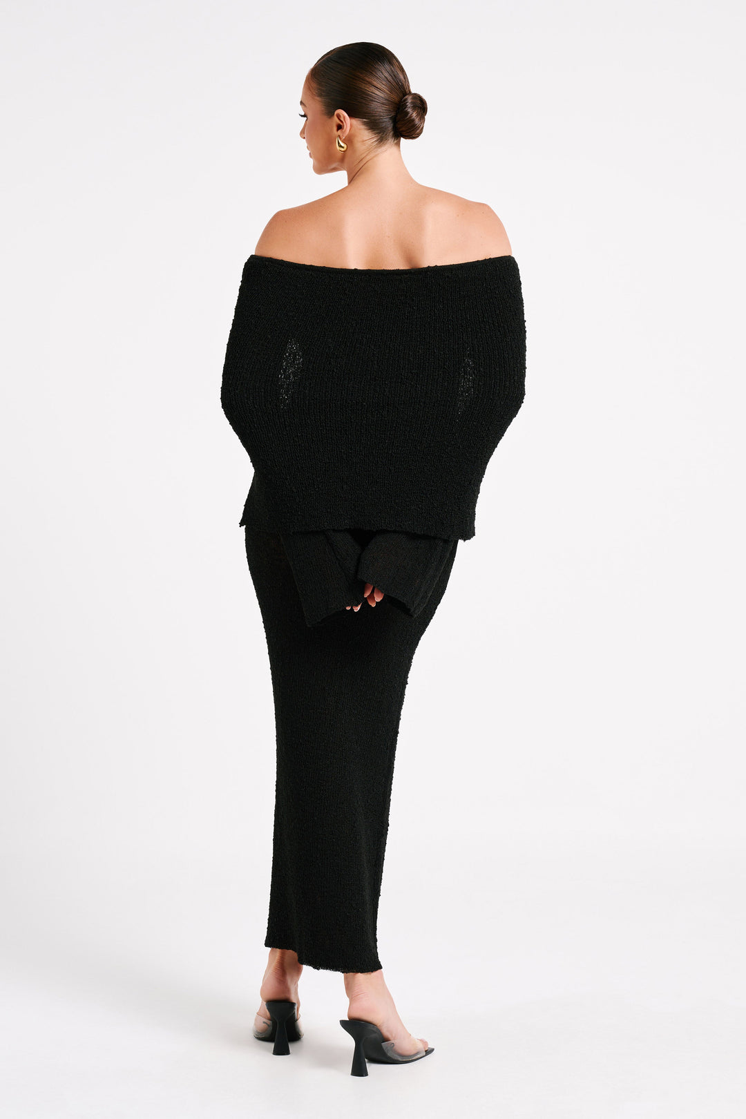 A beautiful women's off-shoulder maxi dress, offering elegant & glamorous evening wear.