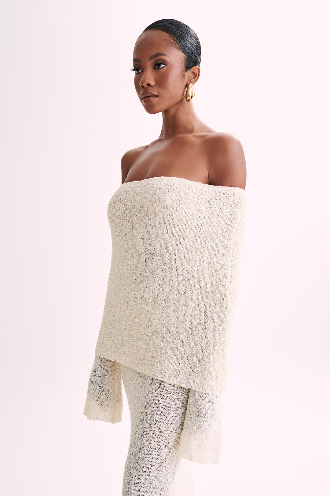 Stunning woman's off-shoulder long sleeve maxi dress, perfect for evening glamour.