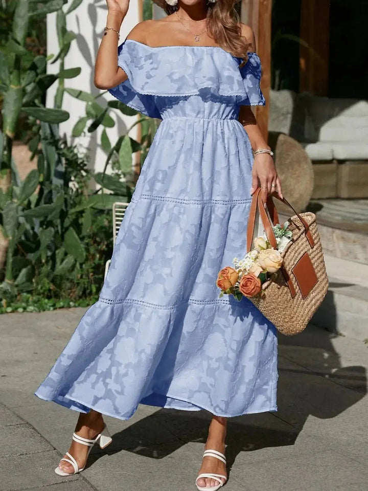 Summer-ready off-shoulder tiered maxi dress with playful ruffles, perfect for holidays.
