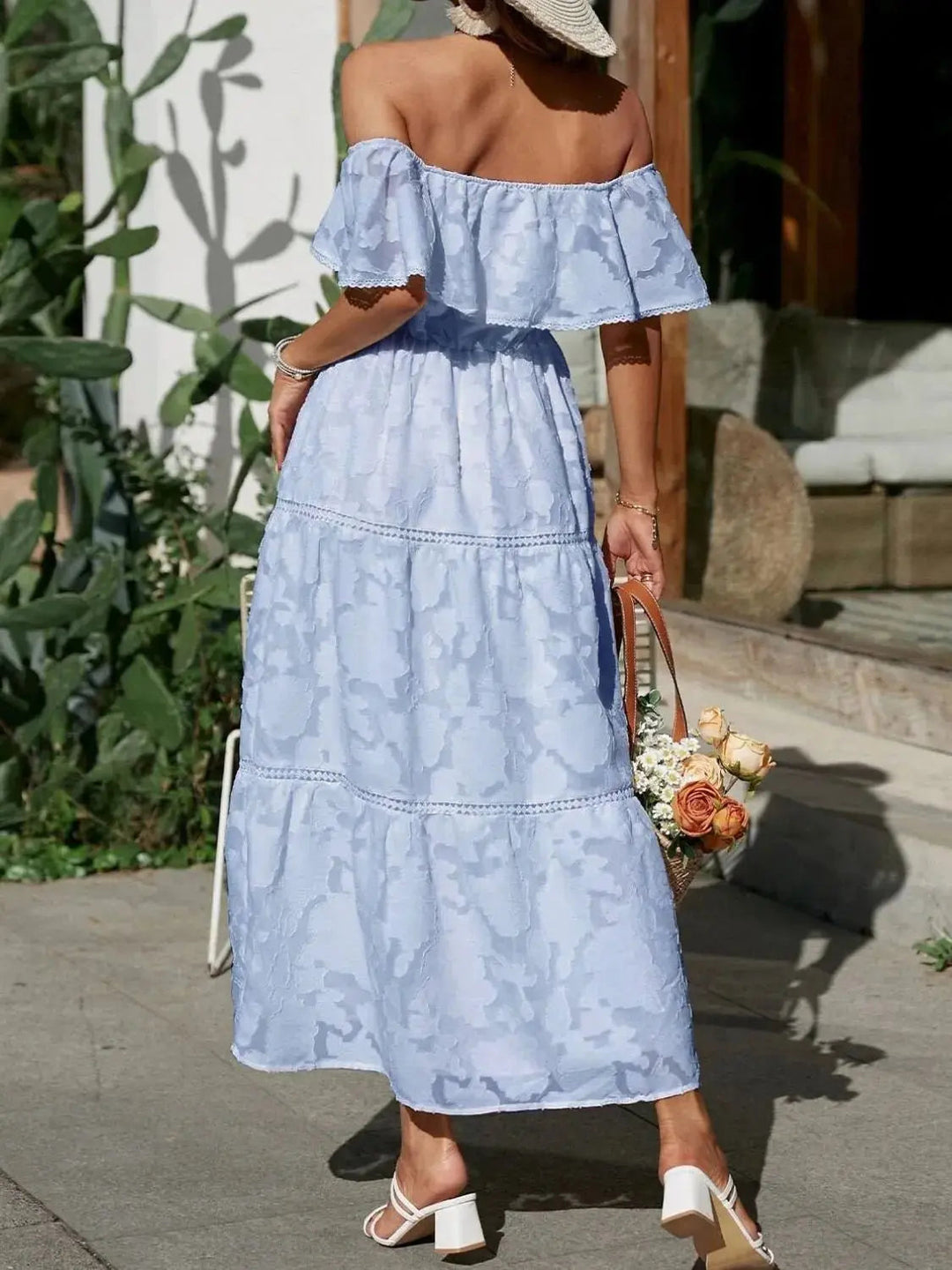 Feminine off-shoulder ruffle maxi dress, offering elegant comfort for summer occasions.