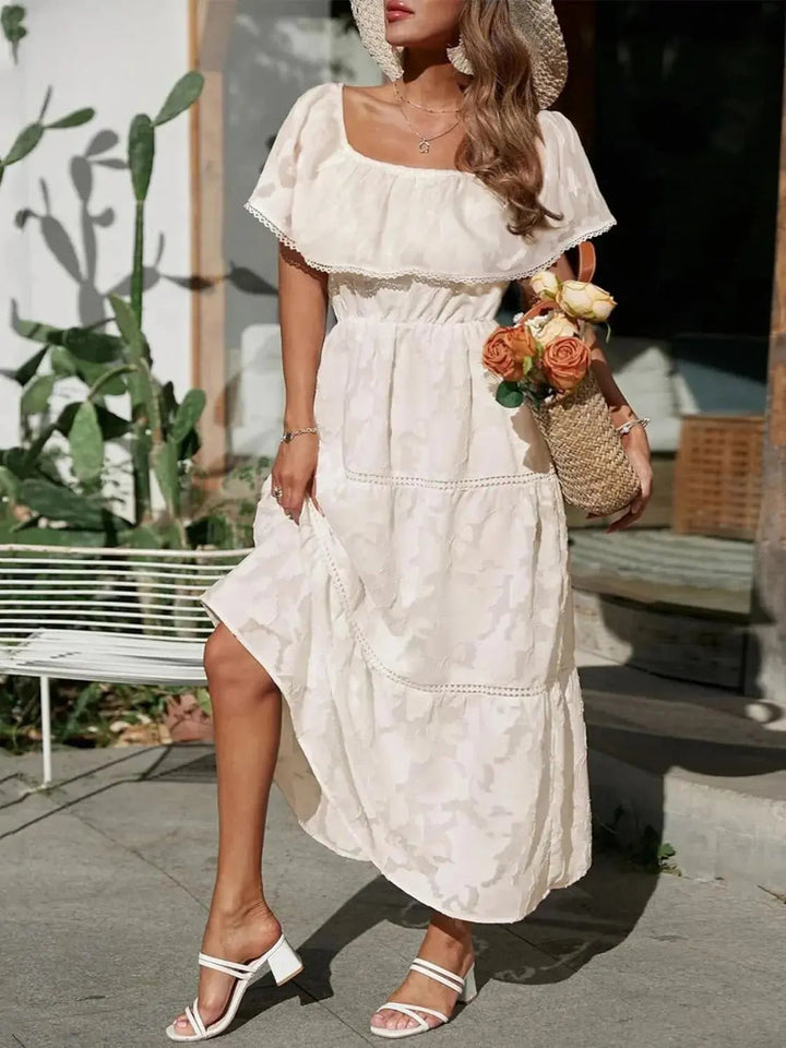 Beautiful off-shoulder bardot style maxi dress with tiered ruffles, a summer party essential.