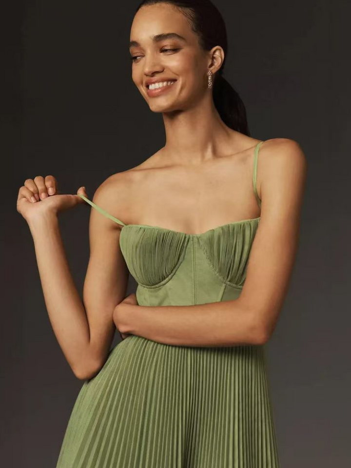 Timeless olive green pleated maxi dress for women. Elegant sleeveless formal gown for weddings & special events.