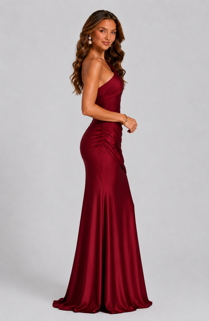 Chic women's long evening dress, one-shoulder style with an elegant draped waist.