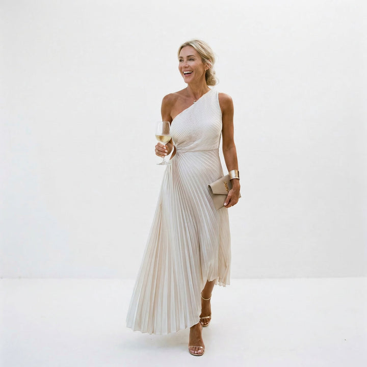 Flowing one-shoulder evening dress with elegant pleats, a sophisticated choice for women's parties.