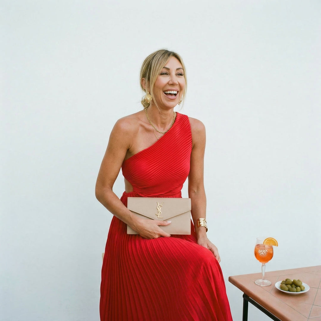 Chic one-shoulder A-line maxi dress with delicate pleats, suitable for wedding guests & celebrations.