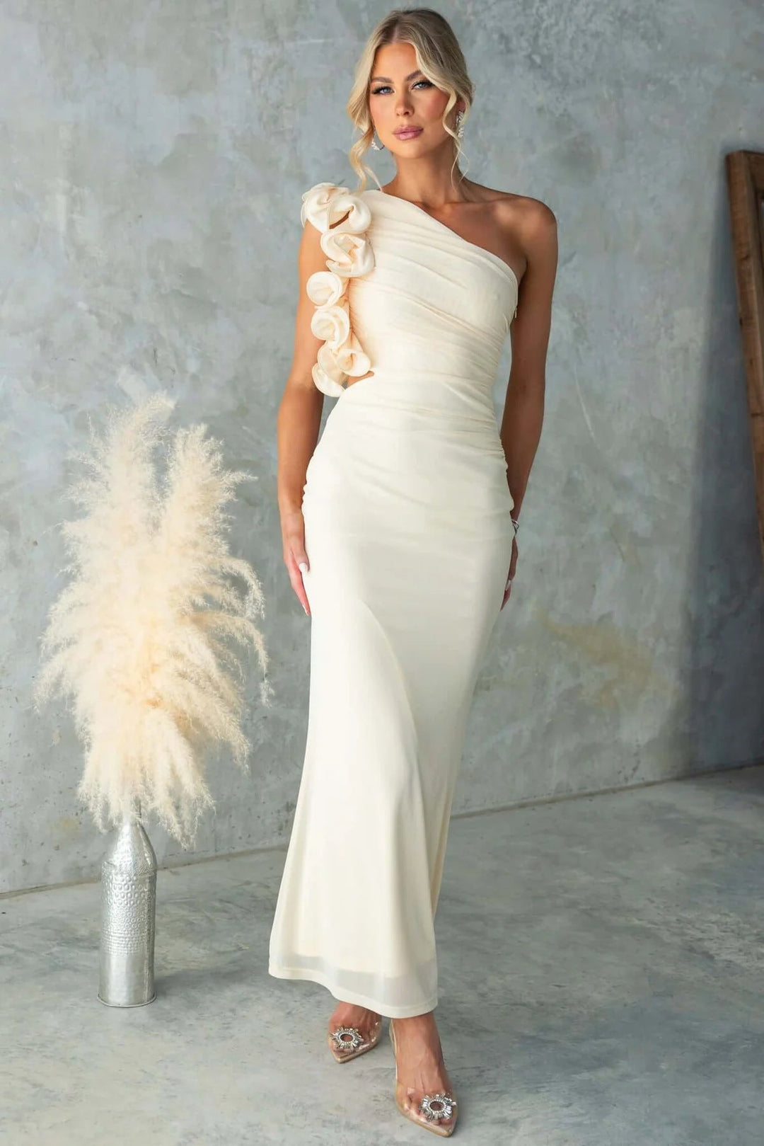 Women's formal one-shoulder maxi dress, designed with elegant ruffles, perfect for evening wear.