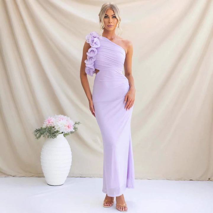 Beautiful women's wedding guest dress with one-shoulder bodice, flowing ruffle skirt & floor-length design.